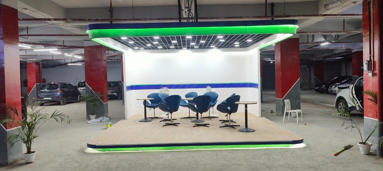 Branded event stage area with green LED lighting