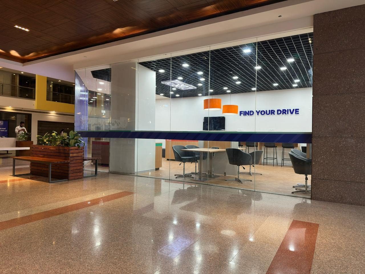 Branded lobby with CARS24 signage and polished flooring